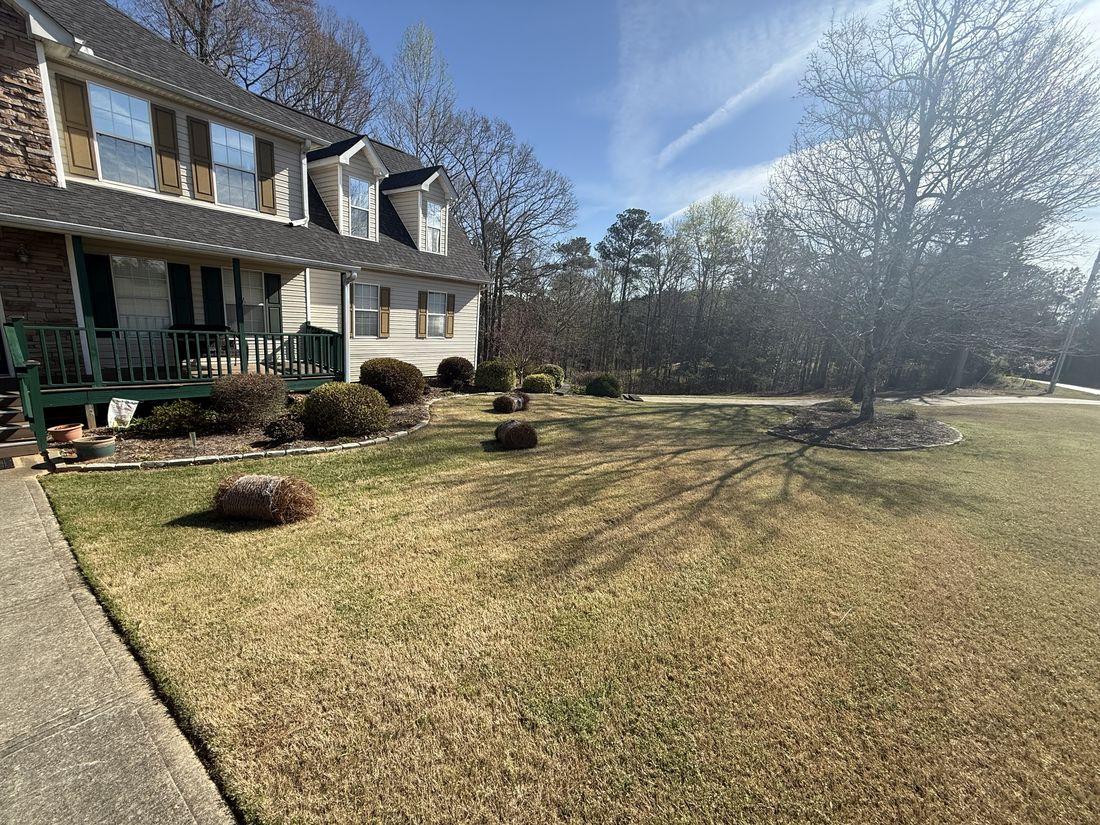 Two-story home with a cleared lawn by Kaus Cuts