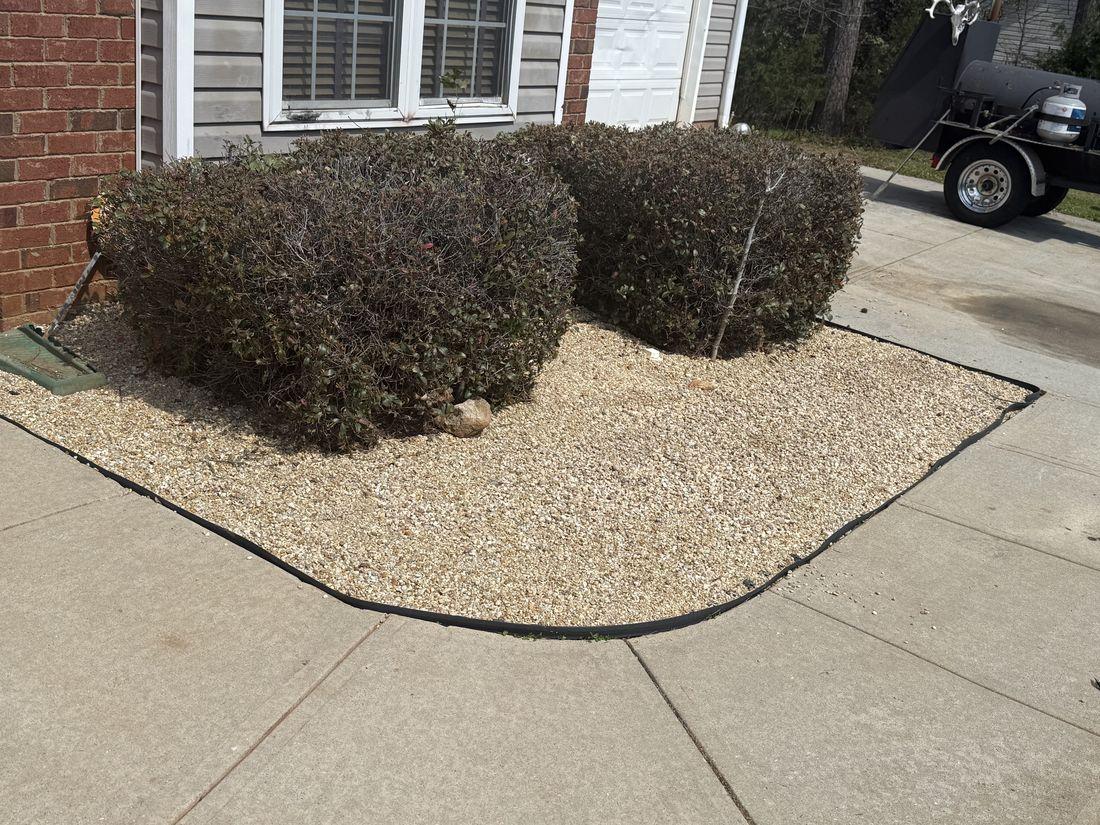 Fresh mulch and trimmed shrubs by Kaus Cuts